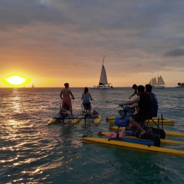 a group of people in a boat on a body of water